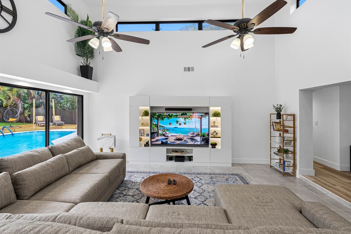 Modern entertainment center with built-in shelving and curated décor.