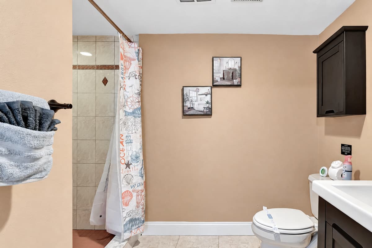 Elevate your bathing experience in this chic and inviting space – a haven of relaxation and sophistication awaits you!