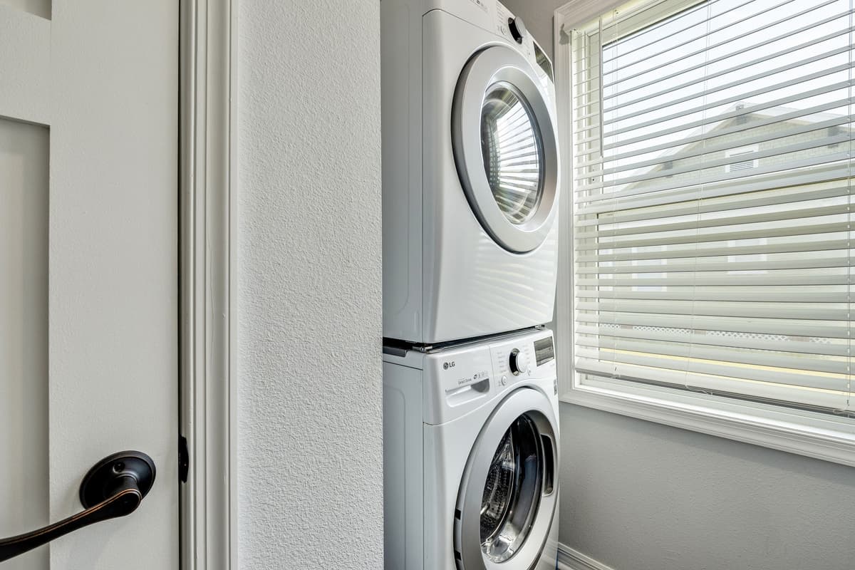 Surrounding the laundry duo are often countertops and workspaces, providing a haven for folding, sorting, and treating stains.