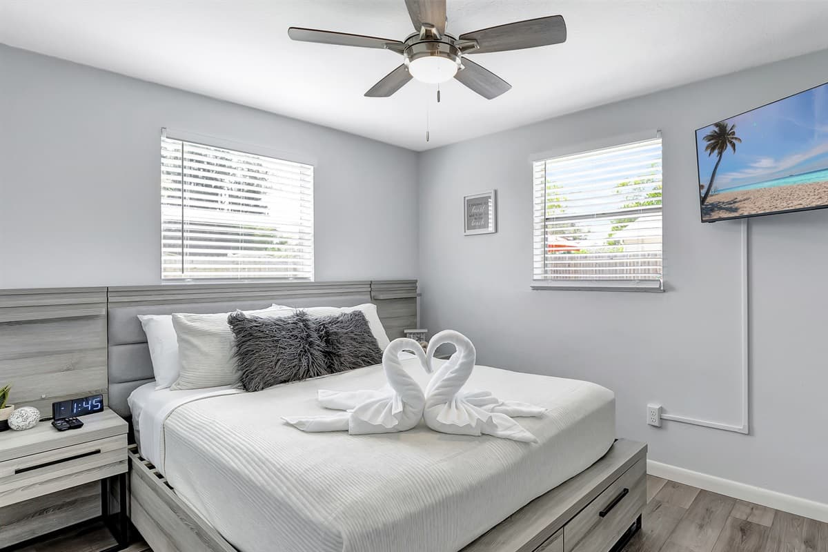 Nestled within is a plush queen-size bed, promising restful nights and lazy mornings.
