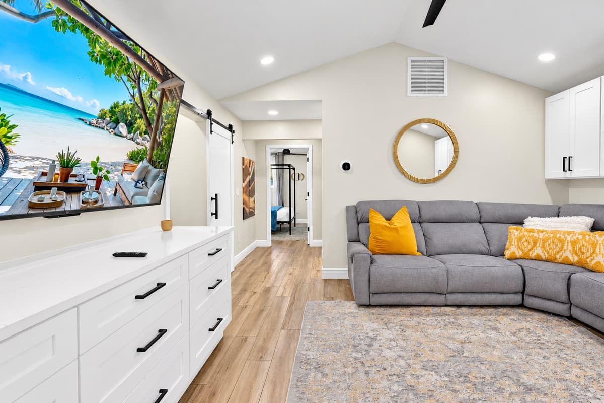 Movie night that doesn't need a vote. Second living area with a big screen and a comfortable sectional, far enough from the pool that you can actually hear the film.
