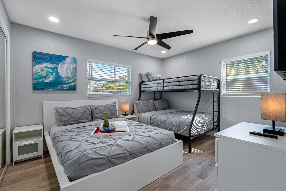 Our magnificent bedroom with a comfortable double sized bed, double over single bunkbed, full length mirror closet, and has its own smart TV. If you think you'd enjoy your trip to this property, send us a message now!
