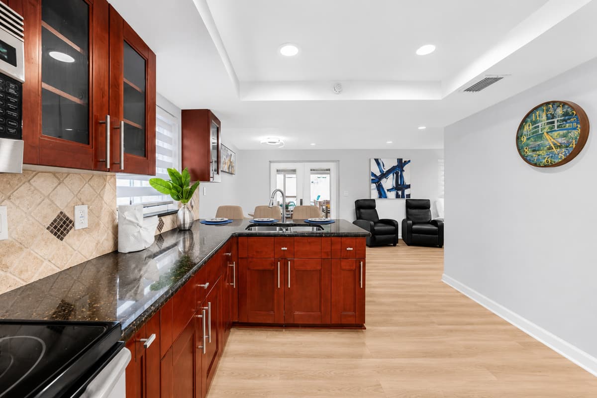 Open-concept kitchen seamlessly connected to the living and dining areas, creating a bright and welcoming space for gathering.