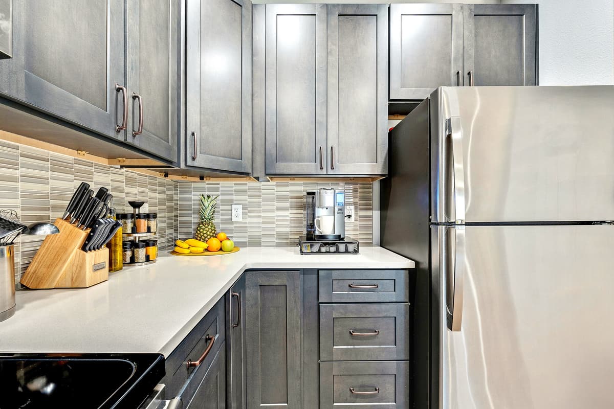 The clean lines, contemporary finishes, and tasteful decor create a modern aesthetic, making the kitchen a visually appealing space that complements the overall design of the home.