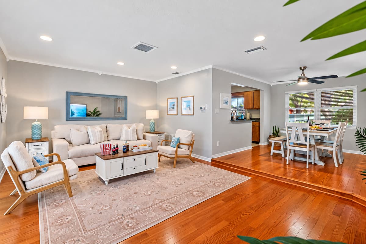 Natural light, warm floors, and cozy seating create a bright and welcoming spot to read, nap, or chat with friends.