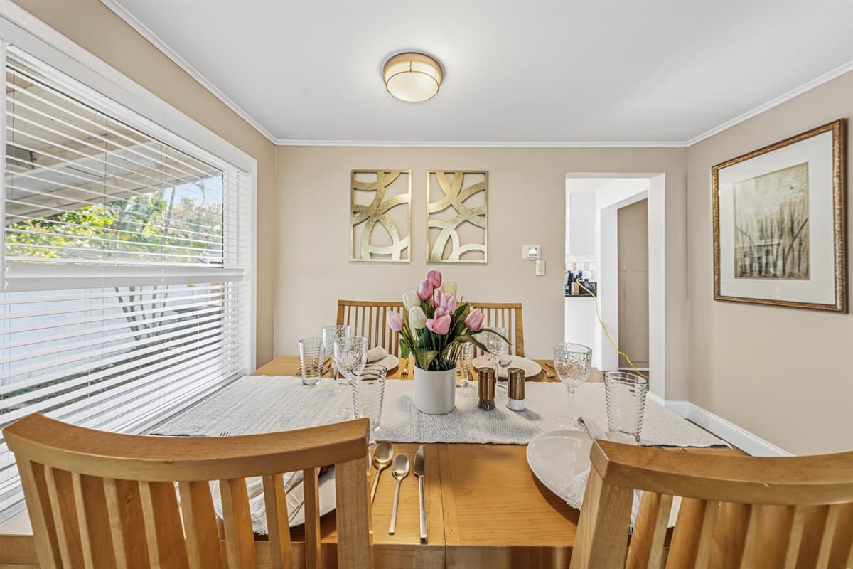 Cozy dining space filled with natural light and comfortable seating.