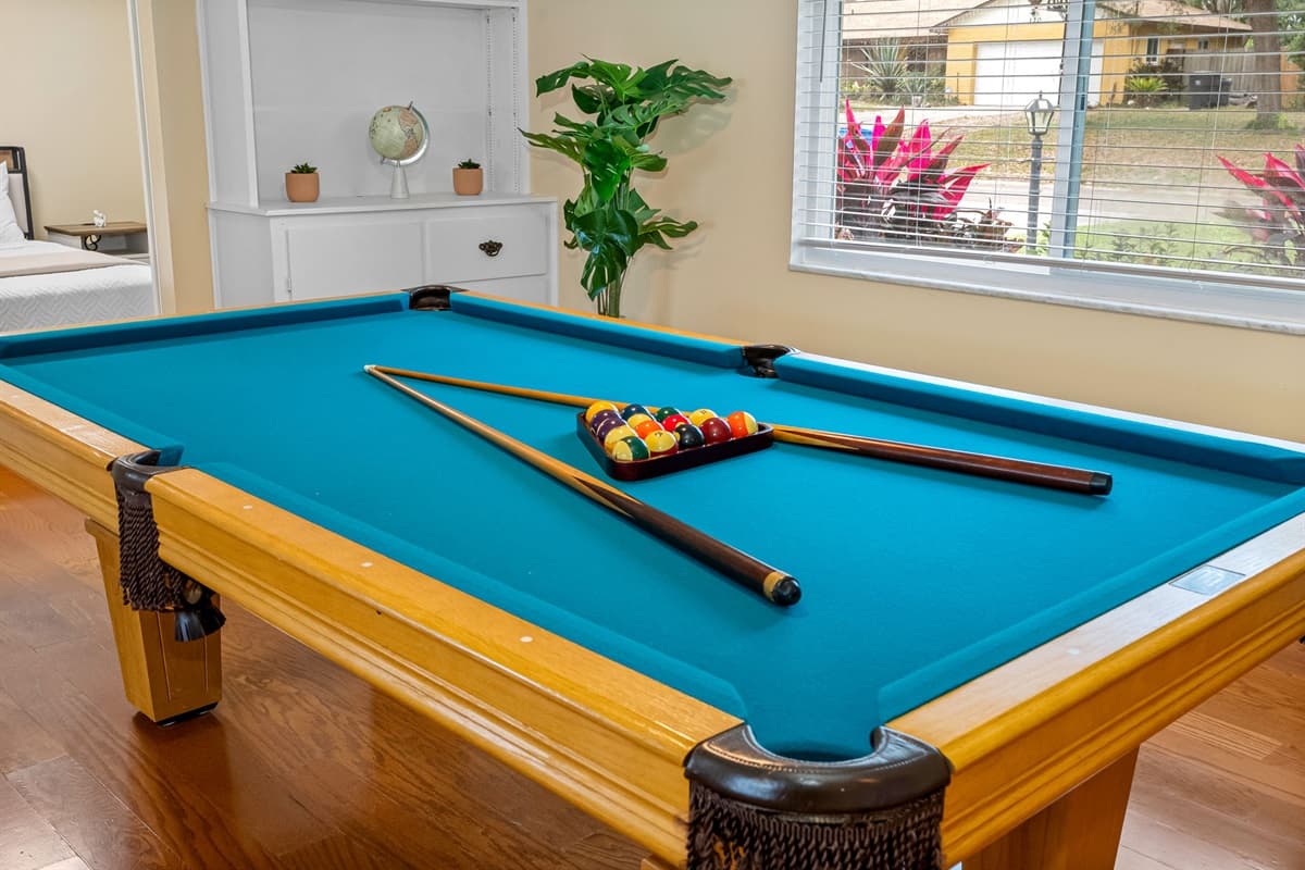 Keep the fun going with this well-lit pool table area just steps from the living room.