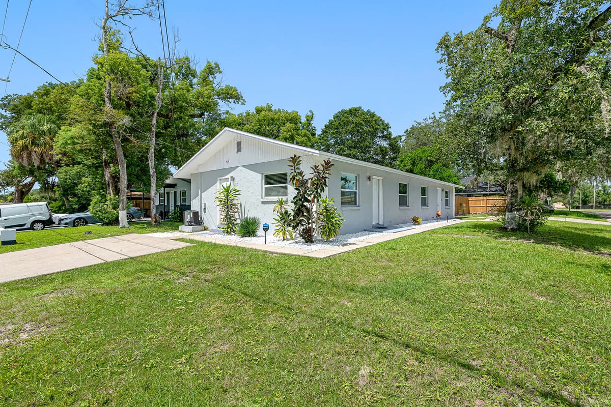 Stunning front view of the house showcasing the front yard and parking area that is equipped with CCTV cameras to ensure your safety during your stay. If you are interested in this property, send us an inquiry now!