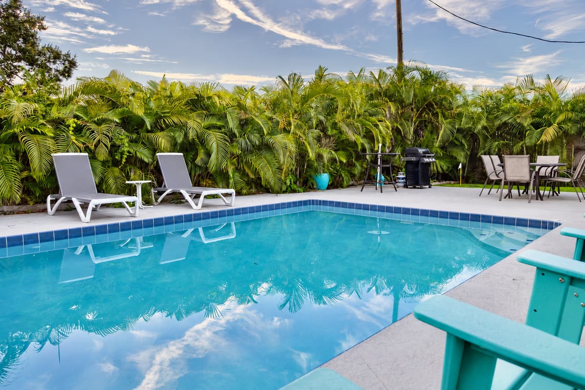 Sparkling clean and inviting, the pool is the centerpiece of this tropical retreat.