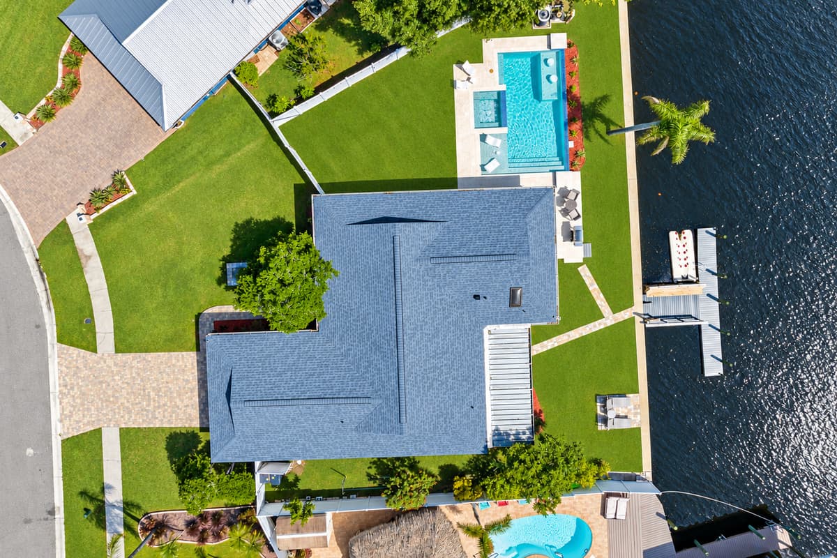 Aerial top view of our immaculate property showcasing the stunning heated pool and lounge area at the back of the property. Do you like what you see? Ask us questions and send us an inquiry as soon as possible!