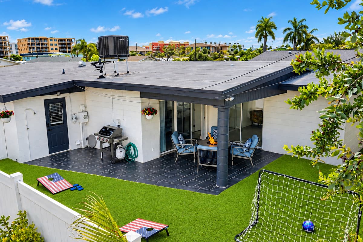 Aerial backyard view showcasing the private outdoor entertainment space and lawn games.