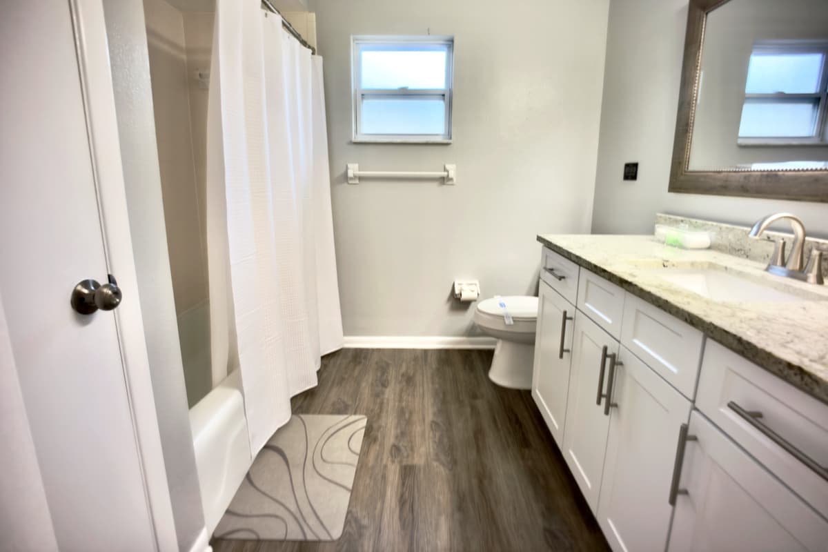 Relax in the master bathroom with a luxurious tub-shower combo, offering both comfort and convenience.