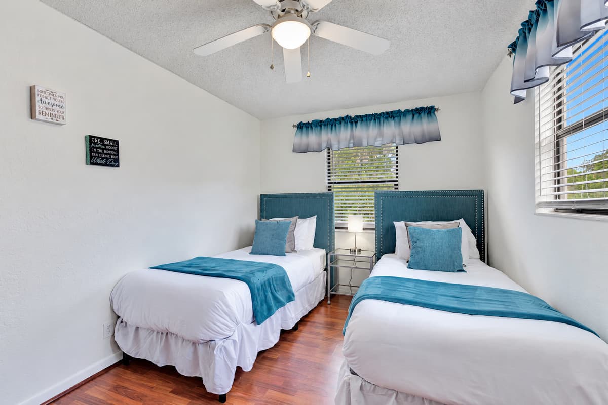 The decor in this bedroom is a delightful mix of modern and traditional elements, creating a warm and welcoming atmosphere.