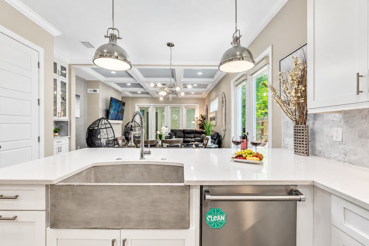 The gleaming countertops offer ample space for meal preparation, allowing you to unleash your culinary prowess with ease.