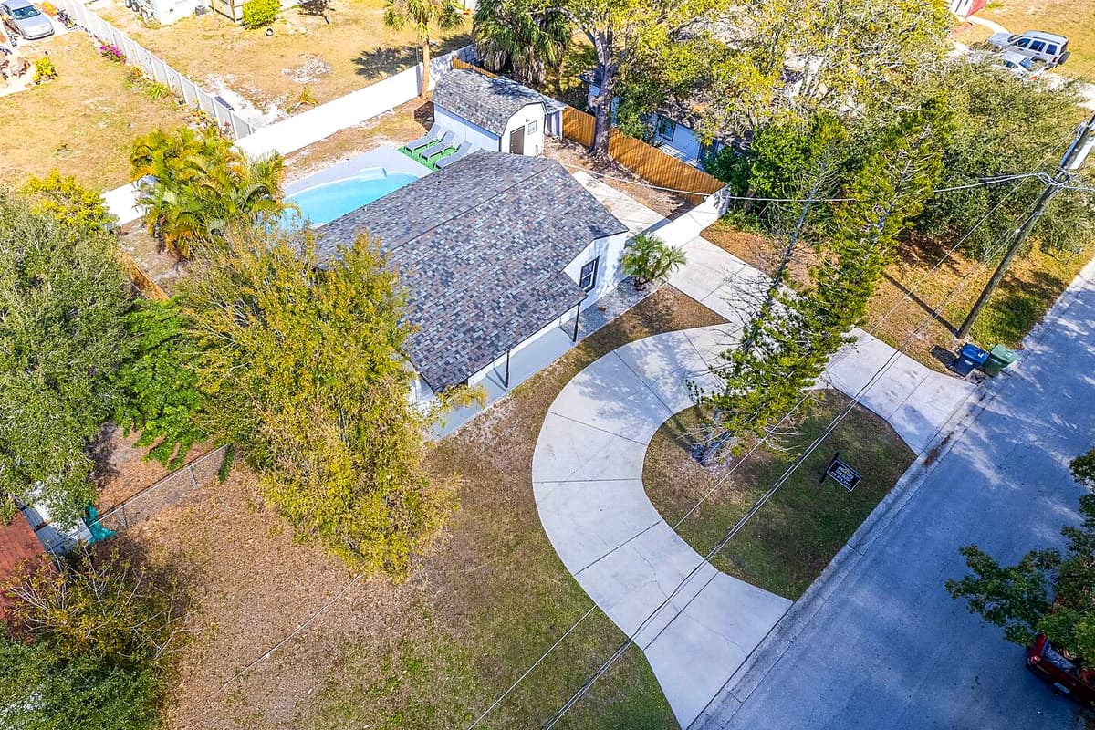 Aerial front view of the house showcasing the lovely driveway where you can park