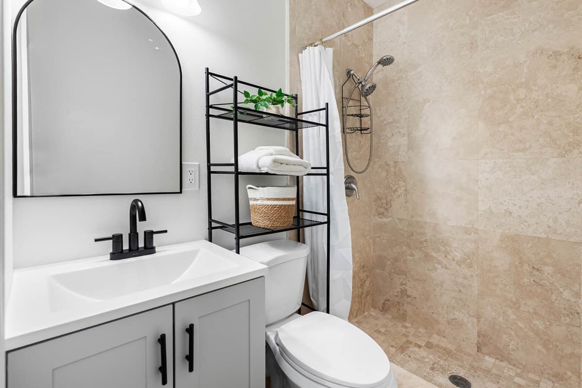 Enjoy a refreshing experience in this well-appointed bathroom, where modern design meets practicality.