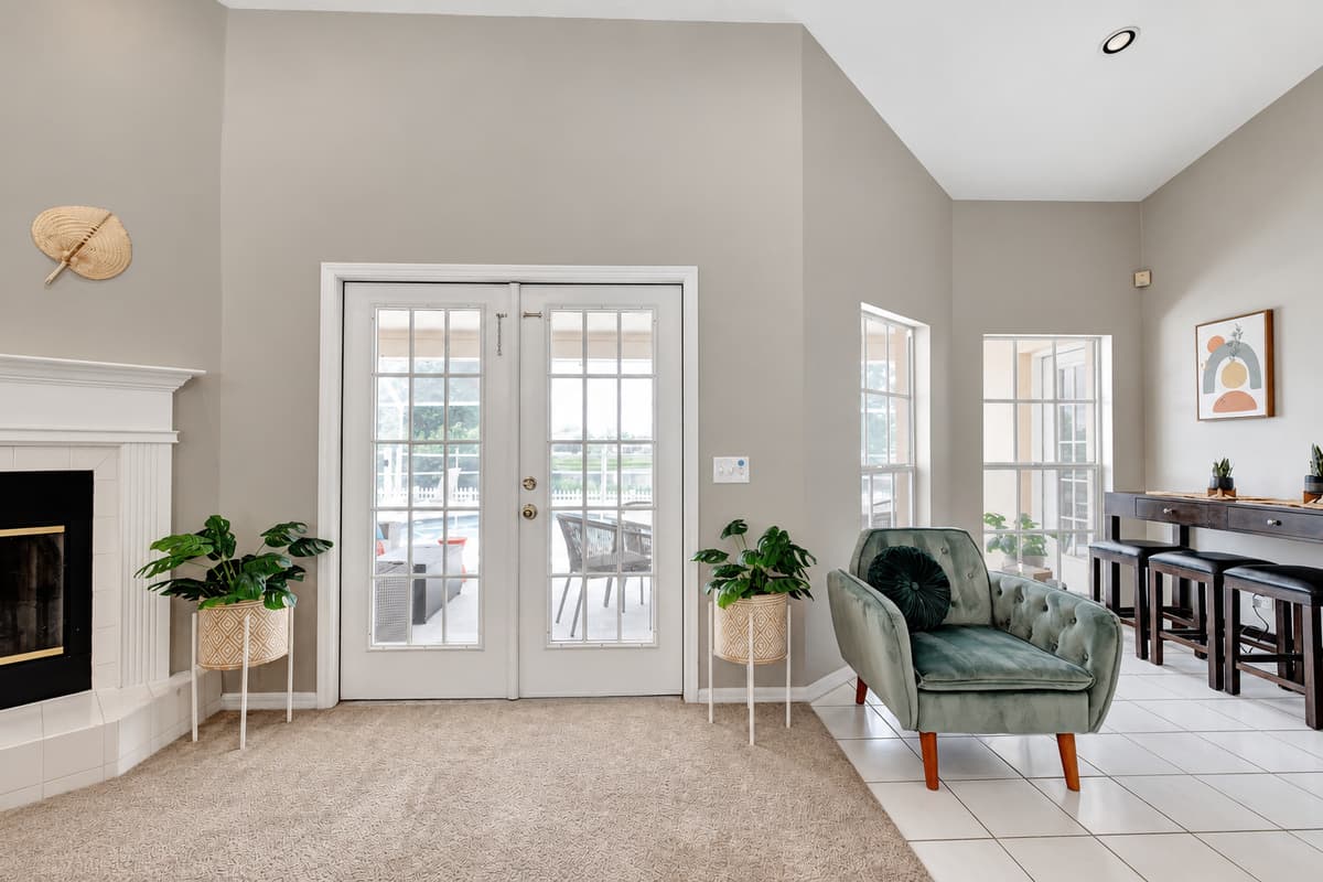 At the heart of the common area, a majestic fireplace beckons, casting a soft glow that invites you to gather around and bask in its comforting warmth.