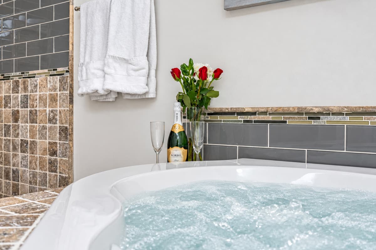 Experience the ultimate in pampering and create your own personal oasis of serenity with our breathtaking bathroom and hot tub.