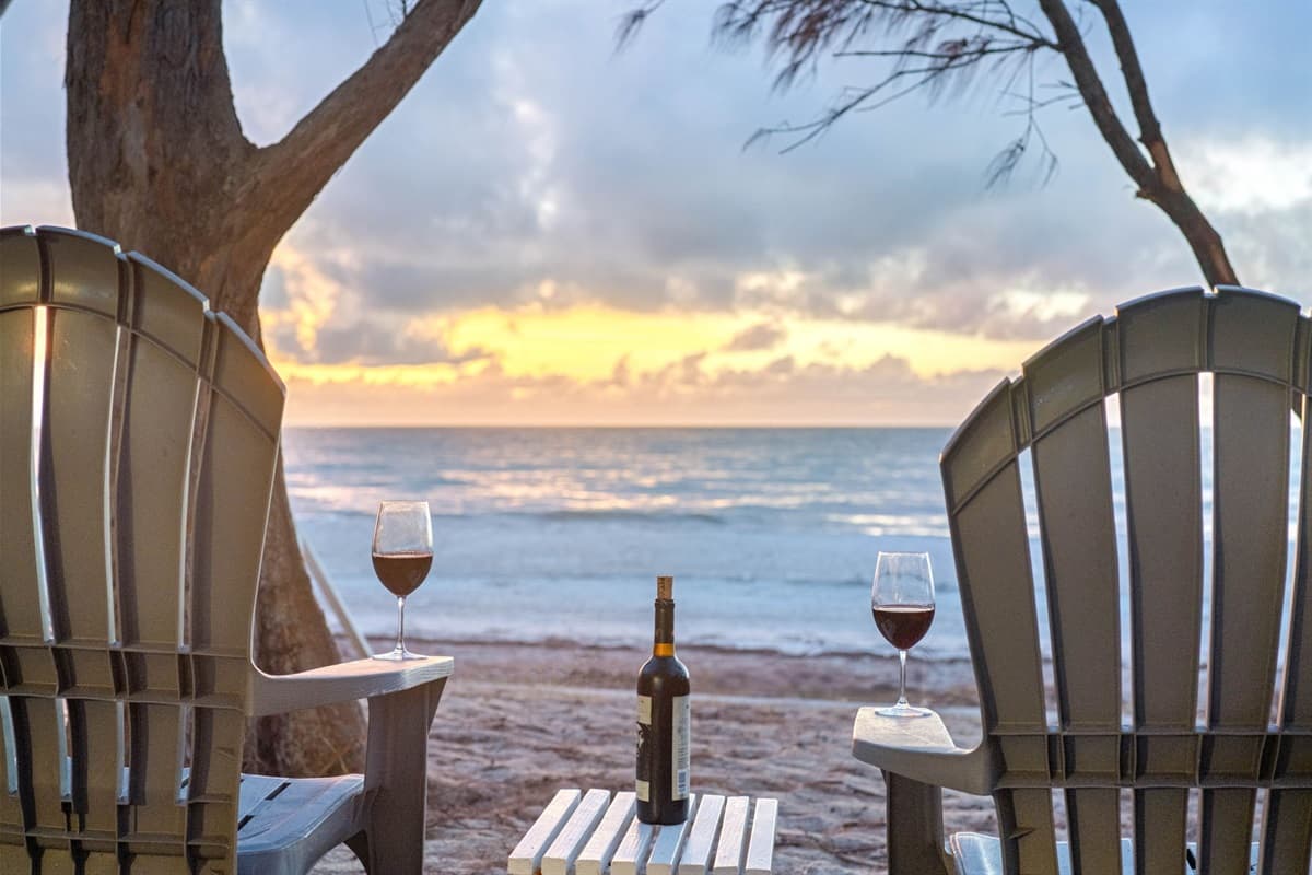 The sound of gentle waves lapping against the shore creates a peaceful atmosphere.