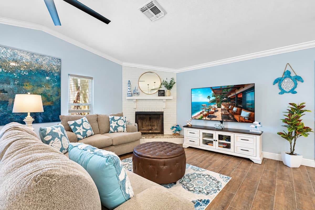 Centered in this inviting space is a beautifully designed smart TV, which not only enhances your entertainment experience but also adds a touch of modern sophistication to the room.