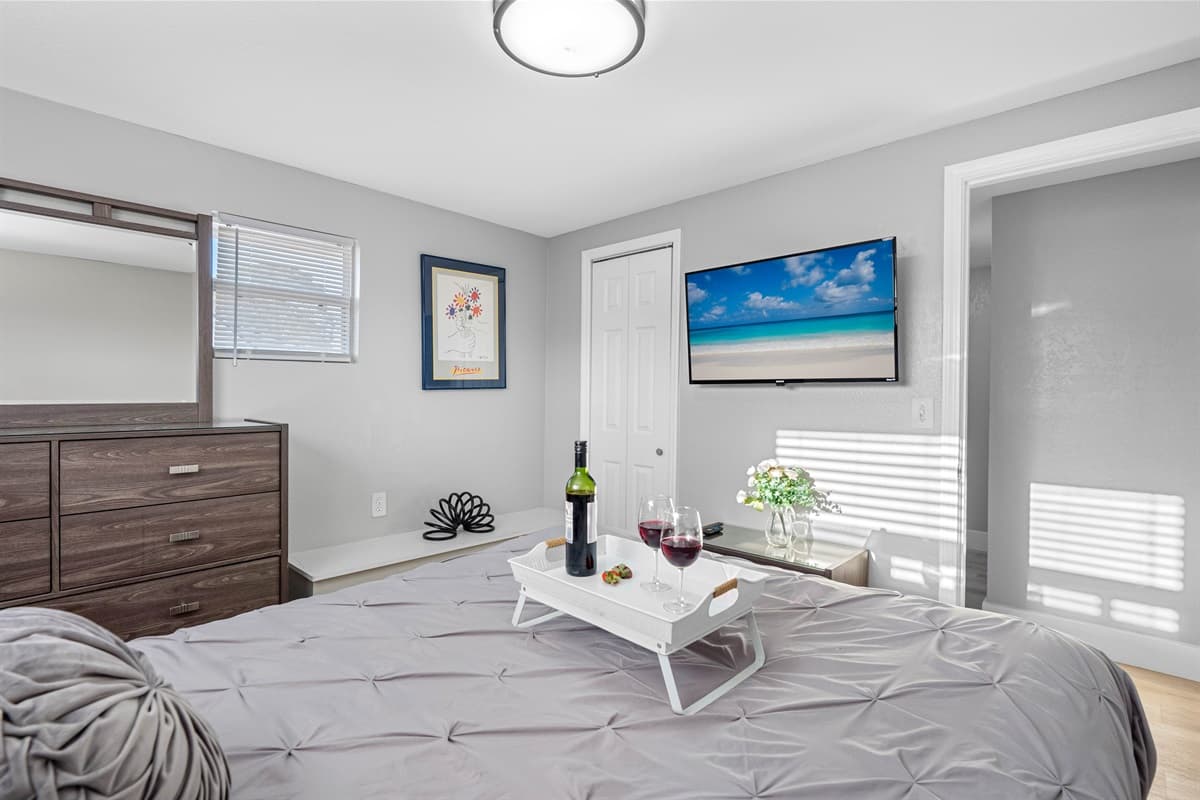 This delightful bedroom boasts a supremely comfortable queen-size bed and exudes an elegant ambiance.
