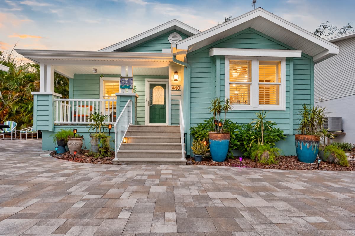 A delightful front porch and bright coastal colors give this home a relaxed, beach-town feel.