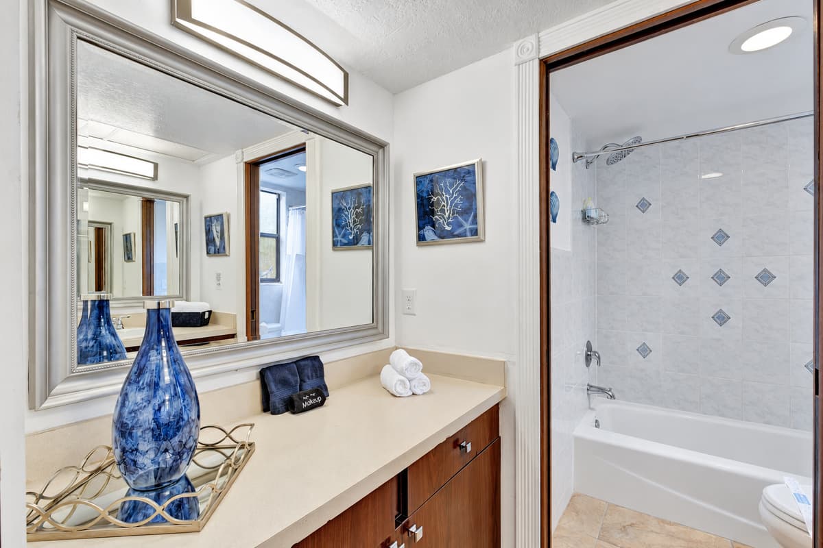 The bathroom is equipped with modern fixtures and finishes, including a spacious walk-in shower or a luxurious bathtub, perfect for relaxing soaks.