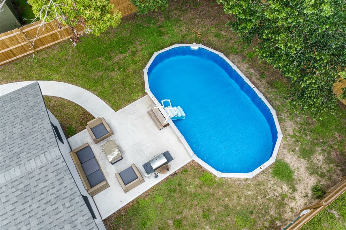 Top view of our lovely property showcasing the stunning heated pool and lounge area at the back of the property. Love what you see? Ask us questions and send us an inquiry as soon as possible!