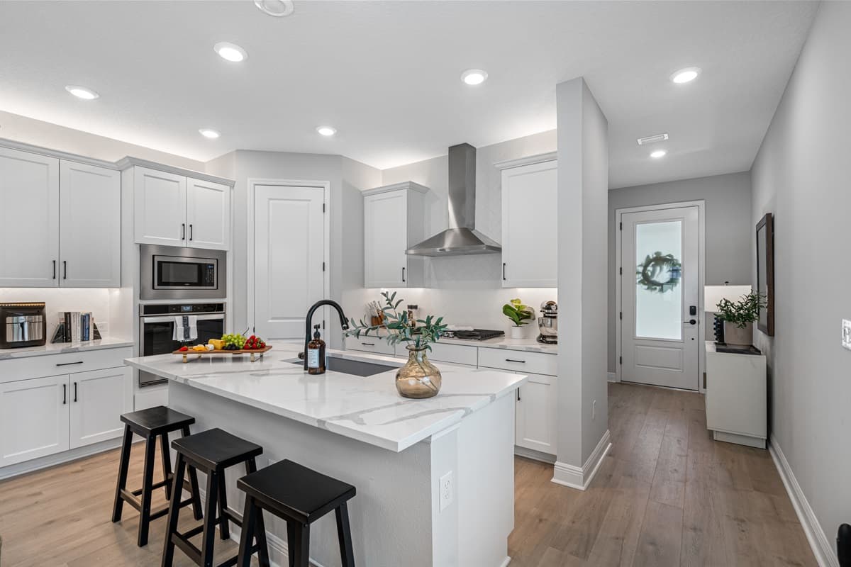 The kitchen is a stunning blend of modern elegance and functionality, designed to be the heart of the home.