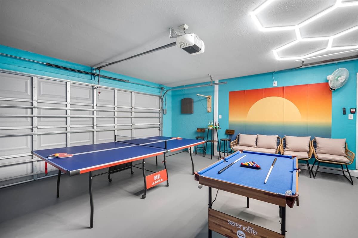 This colorful game room features ping pong, billiards, and cozy seating for everyone to unwind.
