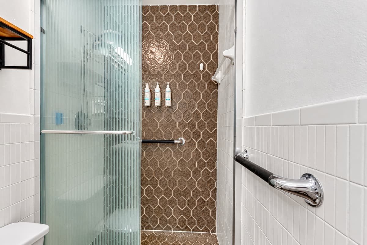 With a walk-in shower, ample storage, and updated fixtures, this bathroom is designed for both style and convenience.