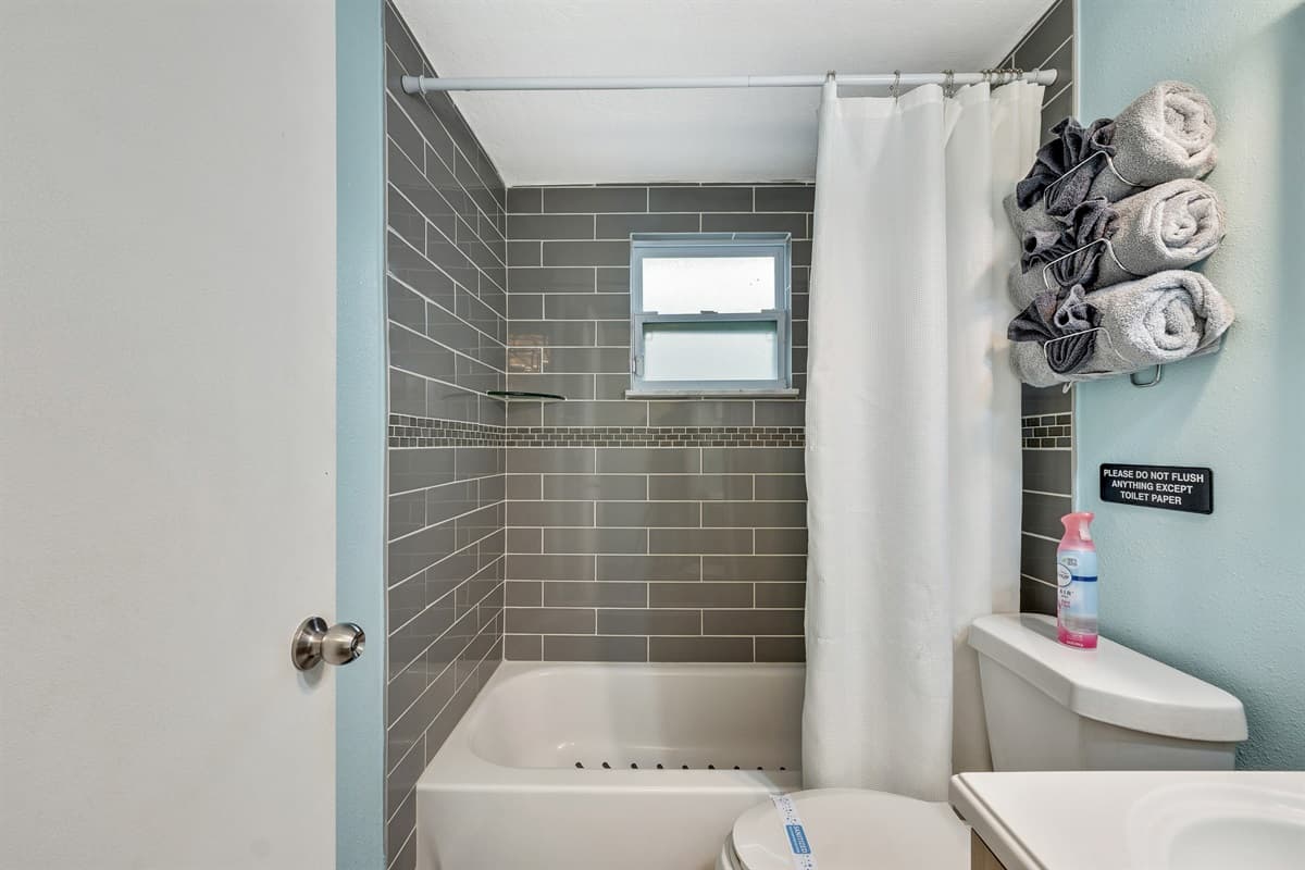 The thoughtful design of this pristine bathroom creates an ambiance that goes beyond mere functionality.