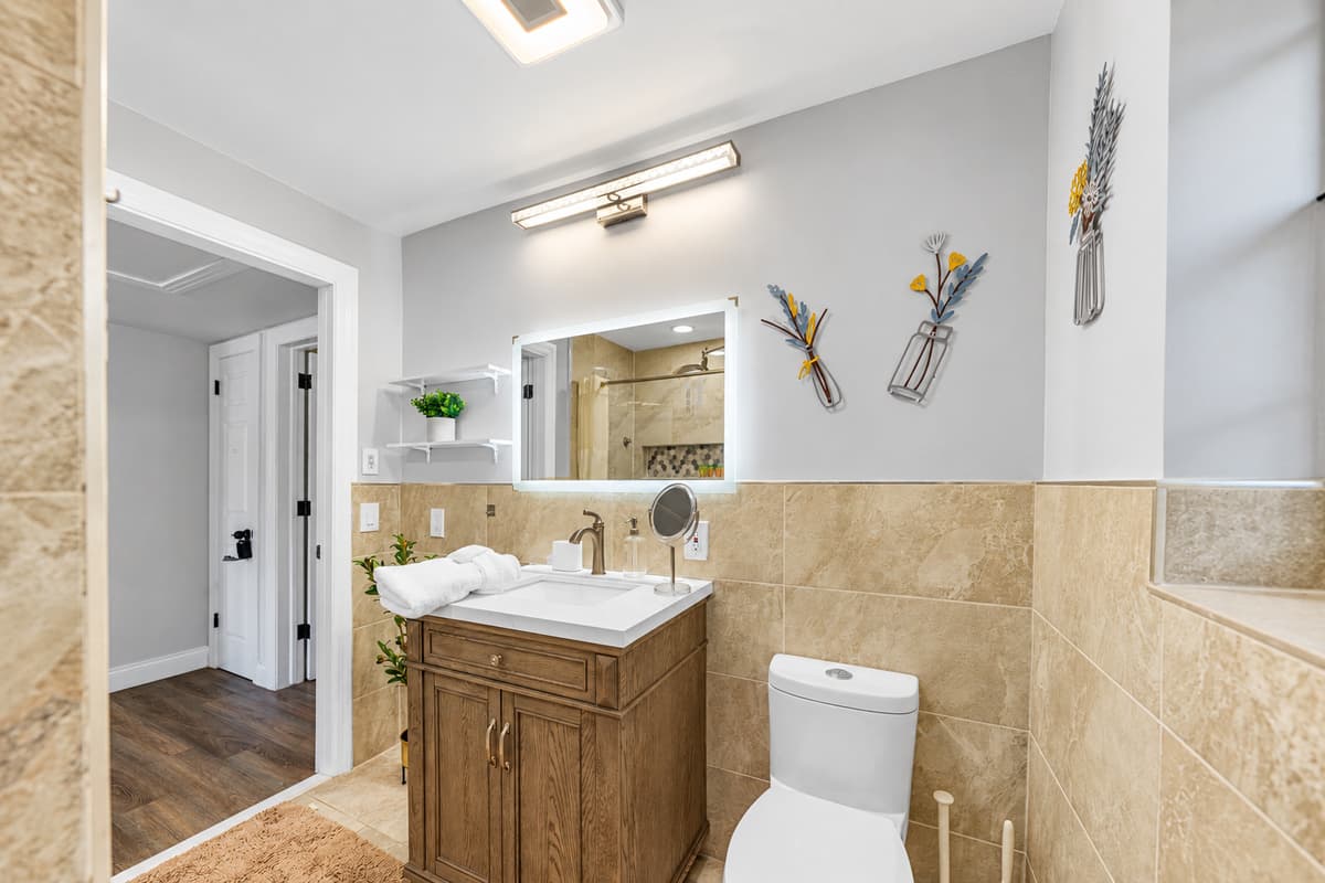 Designed for comfort and relaxation, this bathroom includes a spacious shower and tasteful, modern décor.