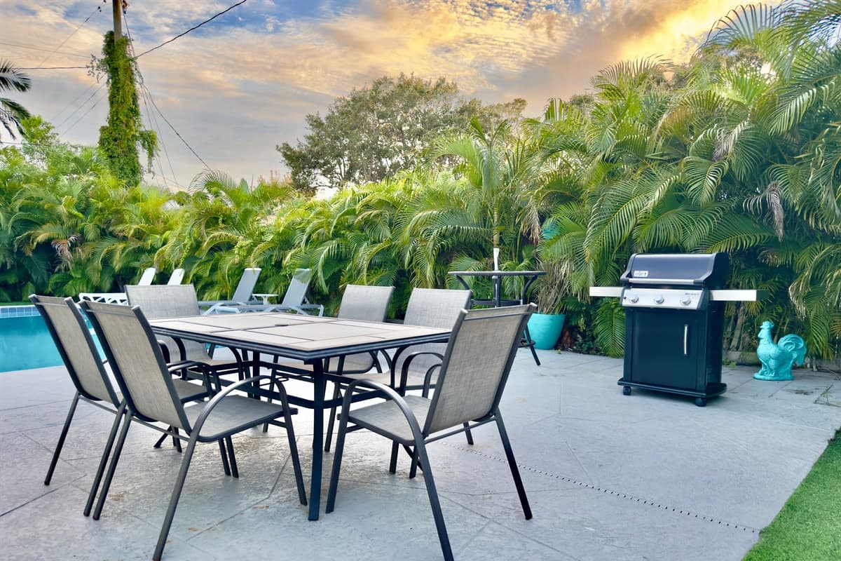 The home’s private pool deck is surrounded by lush greenery, creating a serene and private escape.