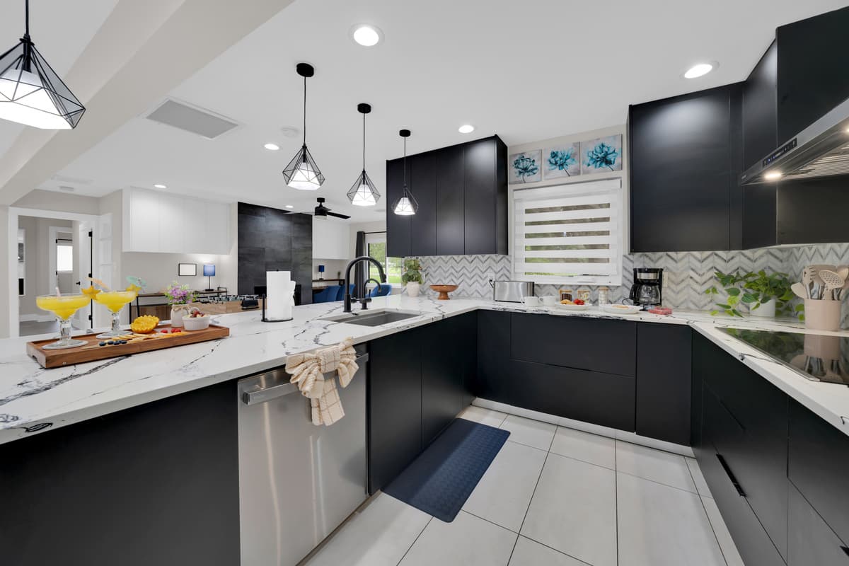 Vacation doesn't mean handwashing plates for eight. This kitchen already thought of that.