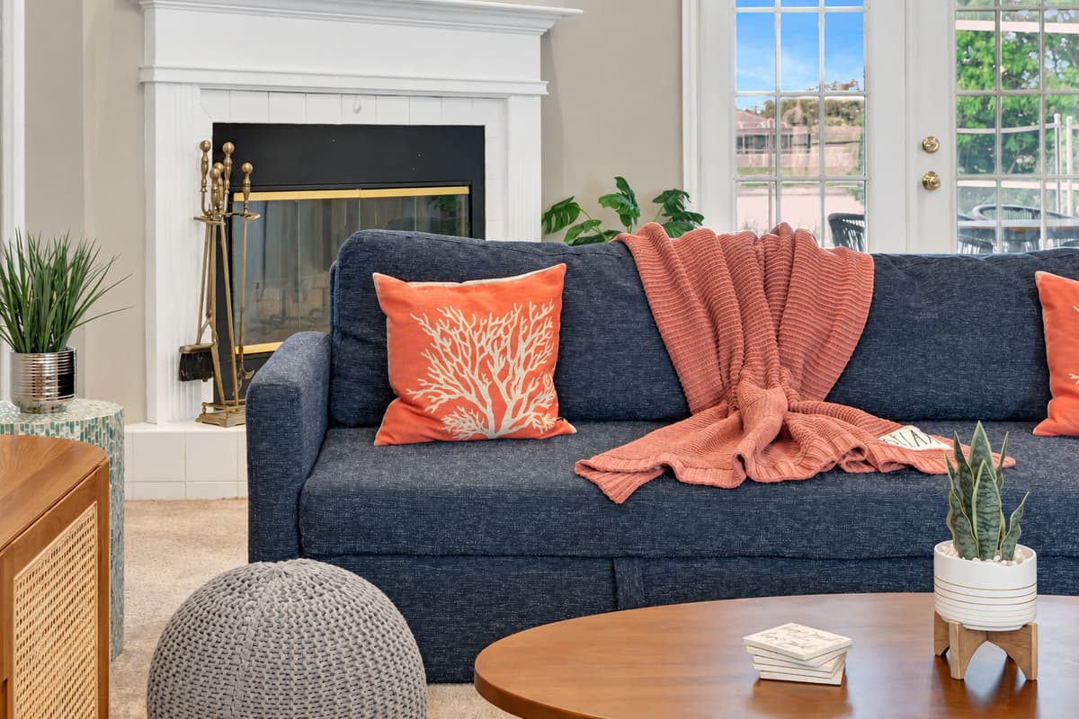The room is thoughtfully designed with a harmonious blend of colors, textures, and decor.