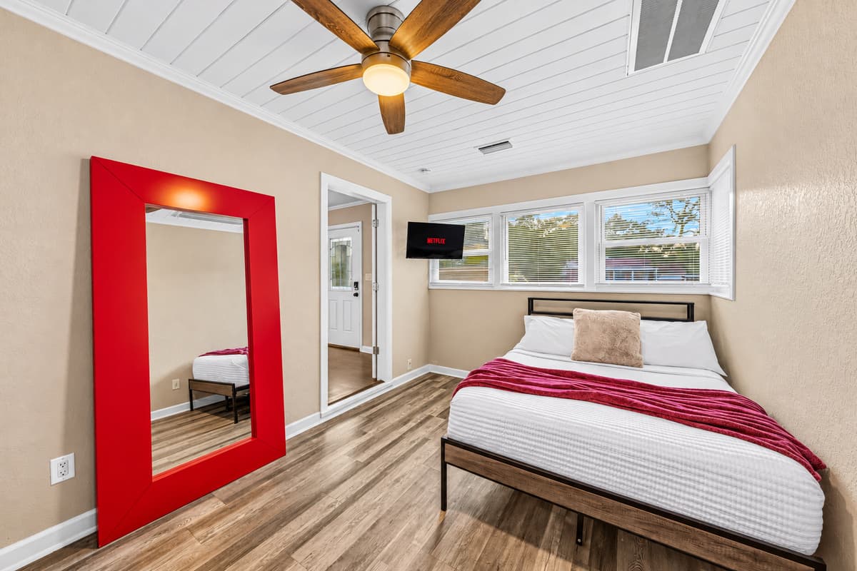 Comfortable bedroom with modern design, cozy bedding, and stylish accents.