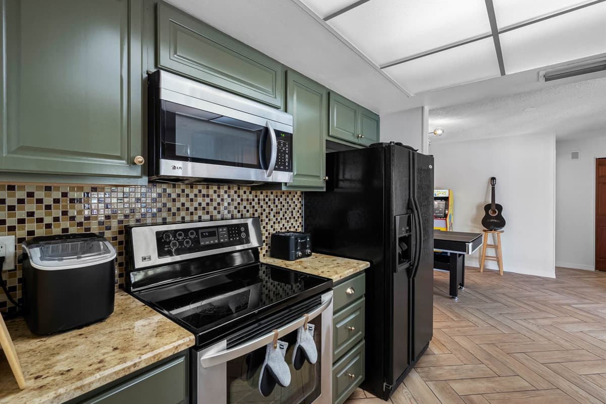 Cook up your favorites in a thoughtfully designed kitchen complete with modern appliances, generous counter space, a double sink, and all the cookware and utensils you’ll need for your stay.