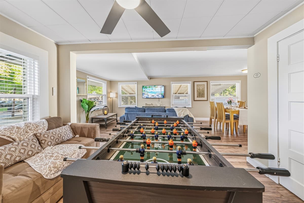 Fun-filled living space with a foosball table—perfect for games and family time.