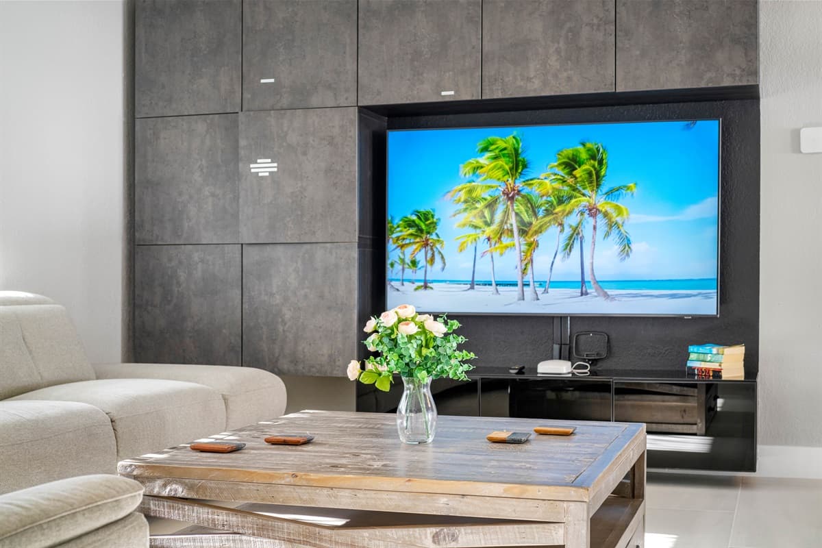 A large living room with a comfortable modern couch will ensure a great time for all of our guests.