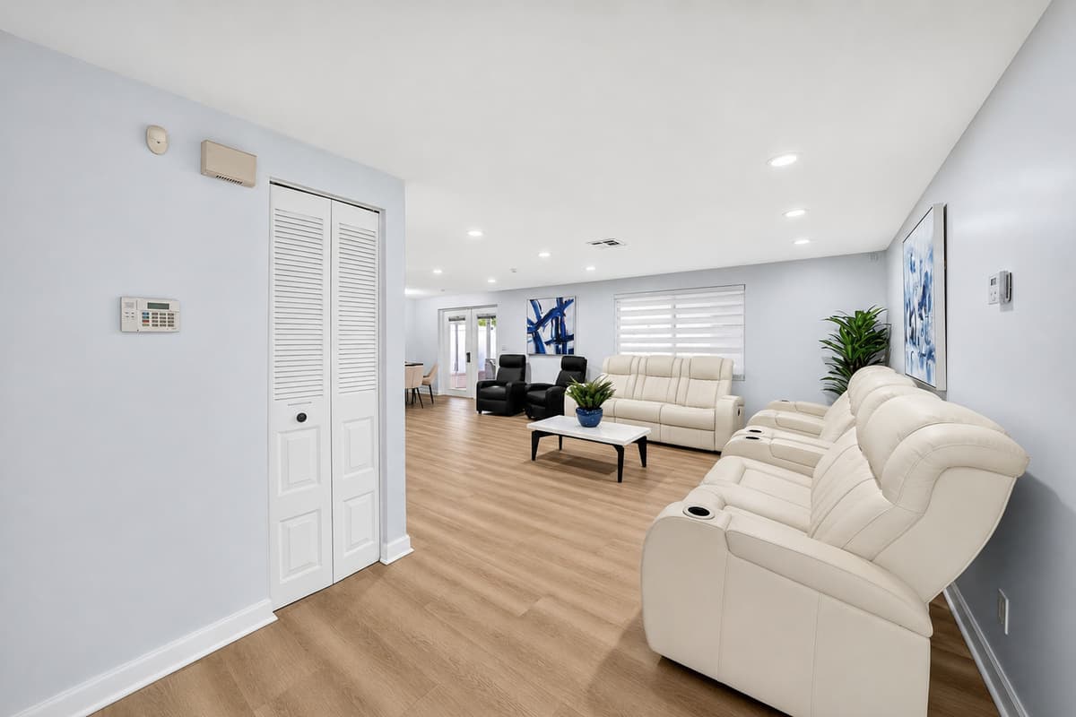 Bright and airy living space with an open layout that seamlessly connects the living room, dining area, and kitchen.