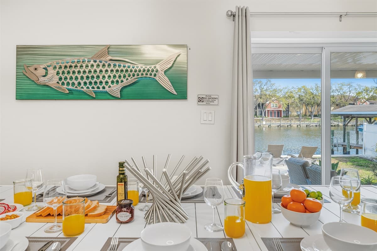 Spacious dining room with scenic water views and abundant natural light.