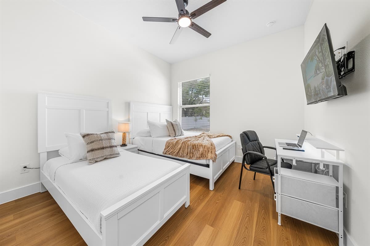 Wind down with soft bedside lighting and a plush bed — the perfect end to a day exploring Tampa.