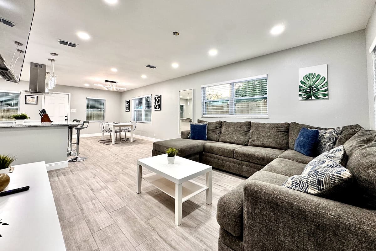 At the center of the living area is a plush and generously sized sofa, designed to comfortably seat your entire group.