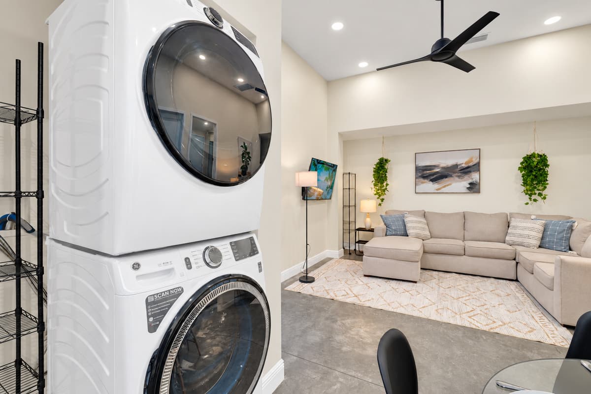 Washer and dryer means you pack half as much. Full-size stacked laundry beside the living area, so pool towels, beach clothes and kids' spills never pile up. Pack for four days, stay for ten.