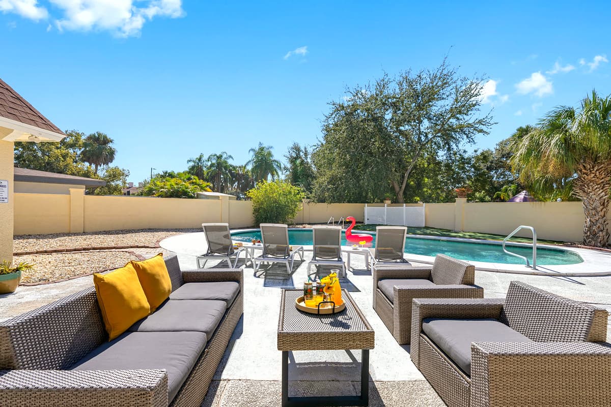 Enjoy long, lazy afternoons in this stunning pool area surrounded by palms and vibrant greenery — ideal for a relaxing getaway.