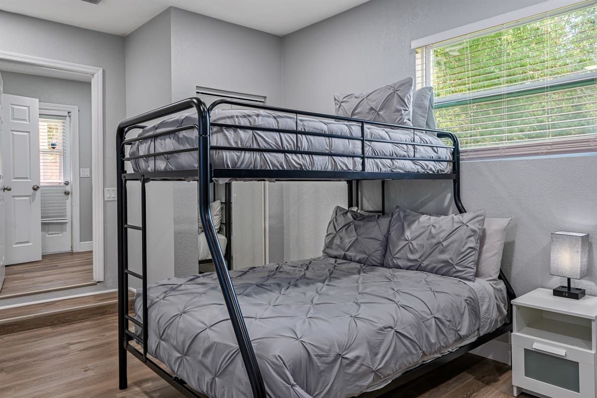 Incredible bedroom that has two single over double bunkbeds, full length mirror closet, drawers and a smart TV. Great for family with kids or an inseparable group of friends. Inquire now!