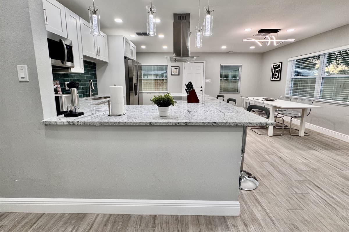The sleek countertops provide plenty of space for meal prep, whether you're chopping fresh ingredients or assembling a delicious charcuterie board.