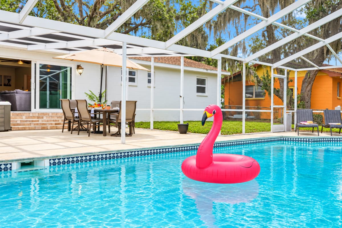 Spacious lanai with a sparkling pool, ideal for swimming, lounging, or family fun.