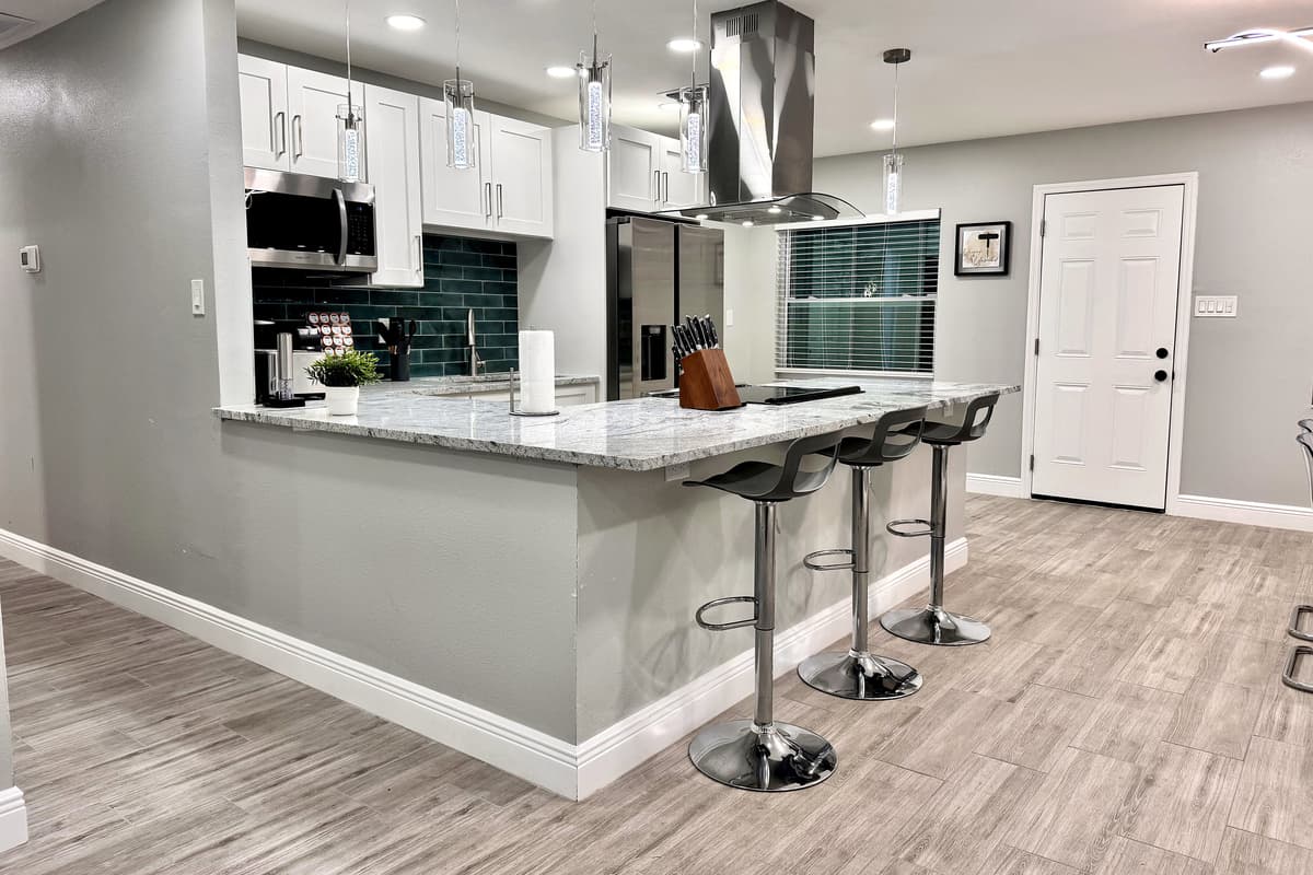 The kitchen flows seamlessly into the dining area, creating a warm and inviting atmosphere for gathering and enjoying meals.